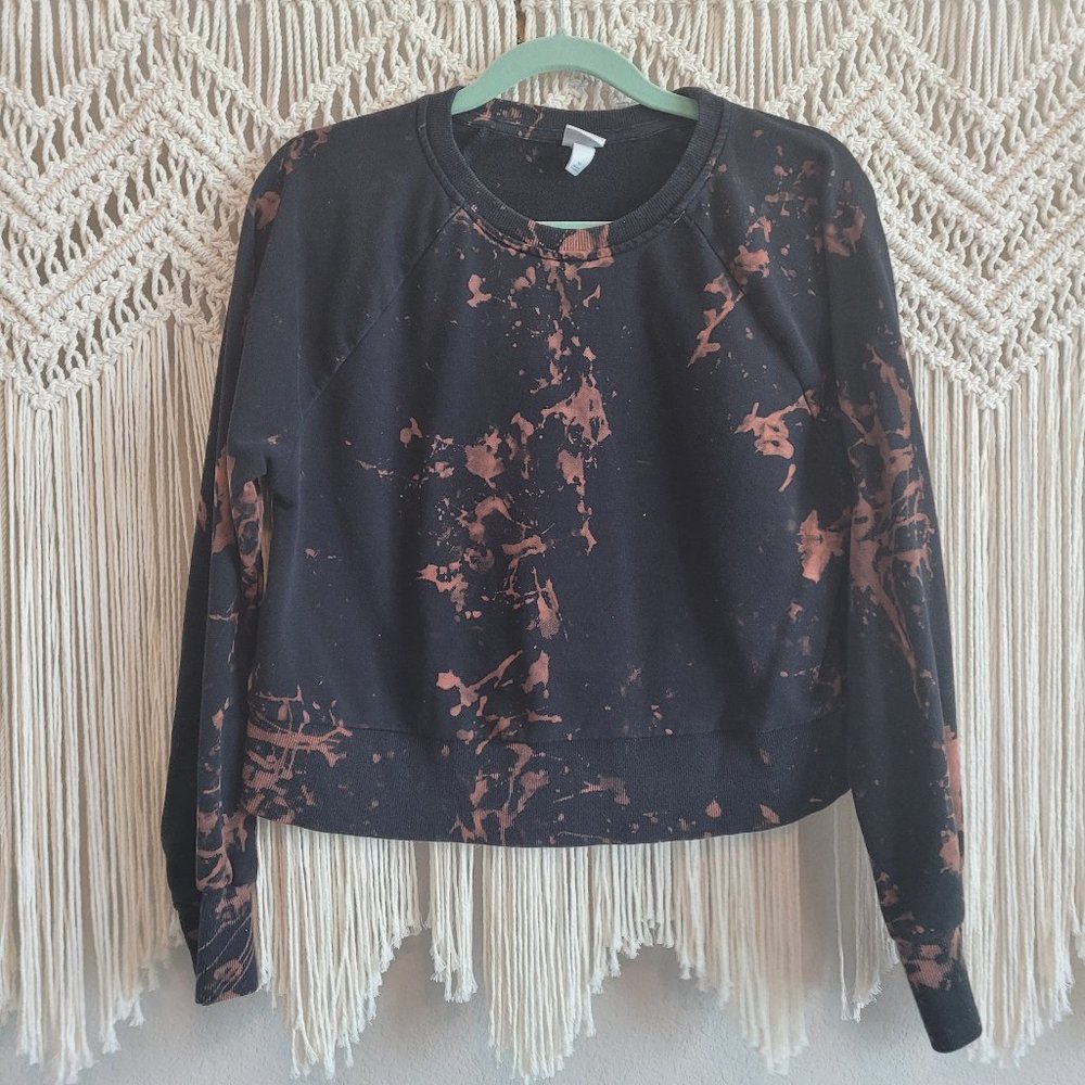 Reverse dyed and distressed cropped black sweater